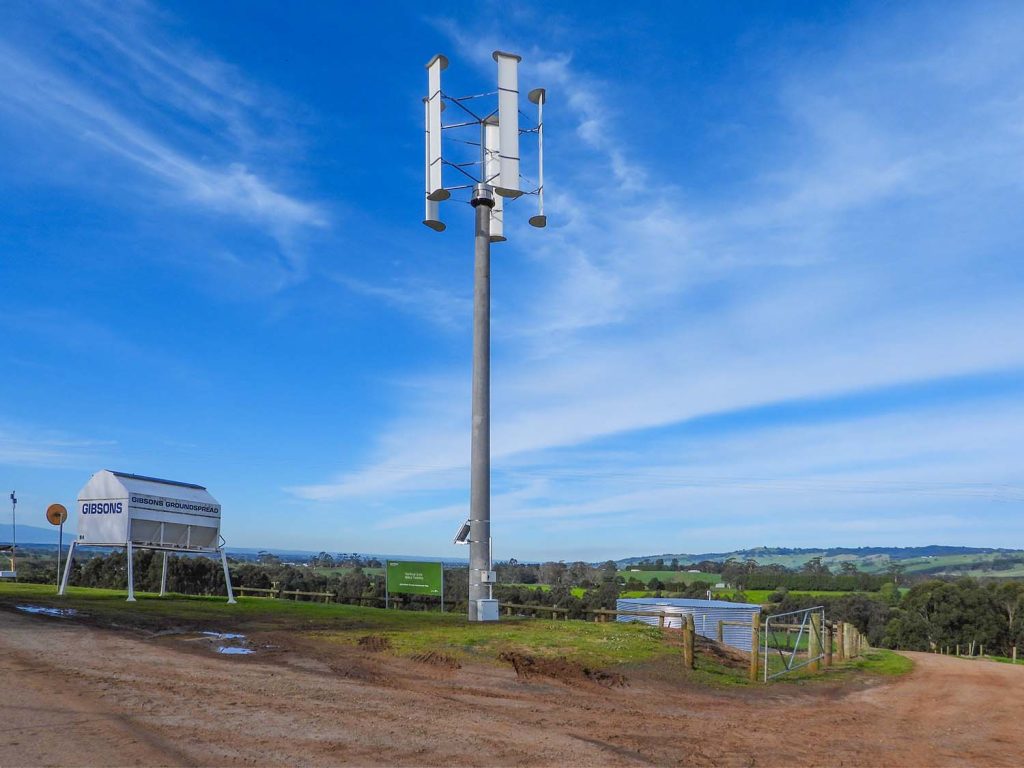 Vertical Axis Wind Turbine (VAWT) mounted on a 12-meter pole to optimize wind flow across the hills.